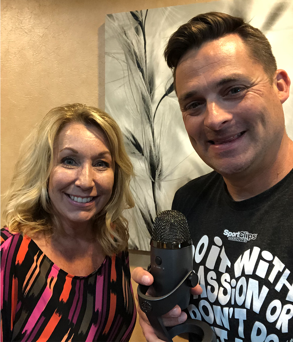 Chad Jordan holding a microphone and Robyn Raphael from St. Baldrick's Foundation